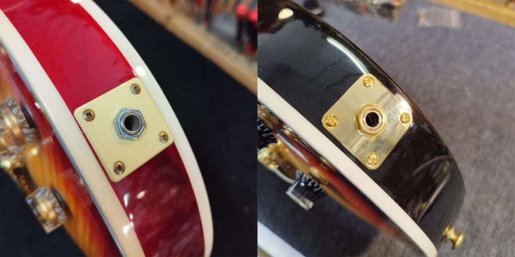 Buchsen zweier Gibson Les Paul Supreme E-Gitarren im Vergleich.